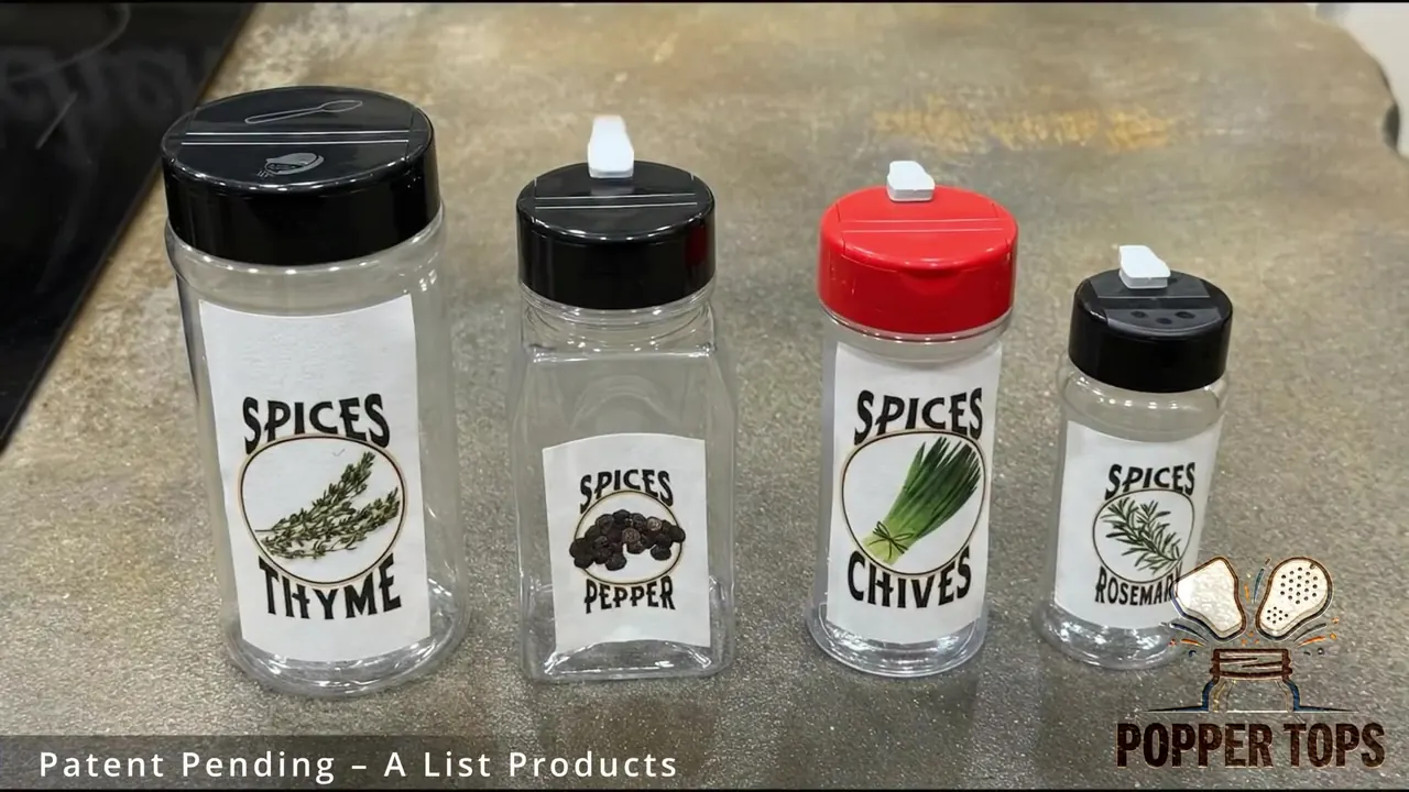 Four spice jars fitted with Popper Top tabs